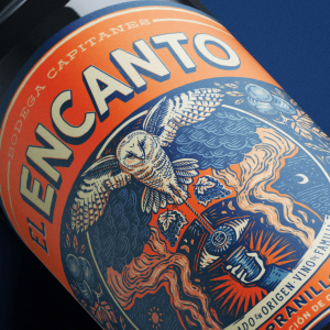 The label features an illustration of an owl holding a glass of wine with a hypnotic pendulum.